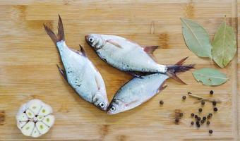 fresh water fish - young bream with garlic and spices photo