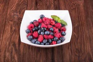 Raspberries with blueberries photo
