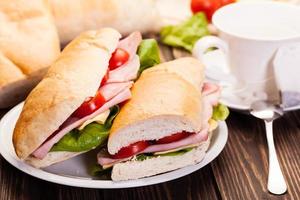 Panini sandwich with ham, cheese and tomato photo