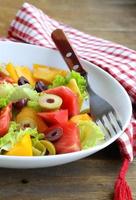 salad of colorful tomatoes and olives photo