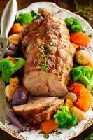 Roast pork with vegetables and spices. photo