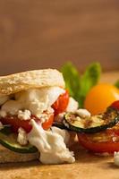 Vegetarian Burger with fried tomato and feta cheese photo