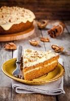 Piece of homemade carrot cake with walnuts photo