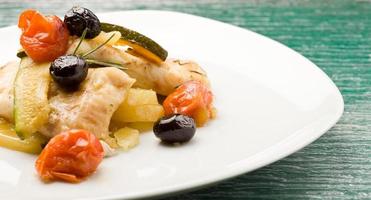 Baked Cod with olives and tomatoes photo