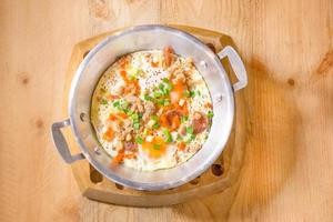 fried eggs pan with minced pork, onion , carrot photo