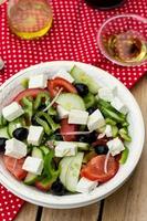 Greek salad bulgarian salad with summer vegetables, olives and feta photo