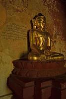 Buddha statue into the temple. Bagan, Myanmar (Burma) photo