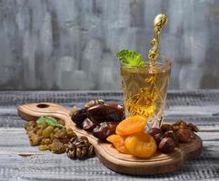 Traditional arabic tea and dry fruits photo