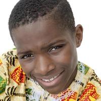 Afro boy smiling, ten years old, isolated
