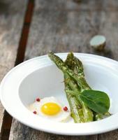 asparagus and fried quail eggs photo