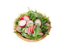 Salad greens with sliced radish photo