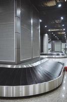 Baggage conveyor belt in the airport photo