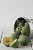 Feijoas in a Bucket with One Cut photo