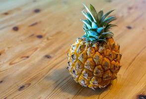 baby pineapple on a wooden table