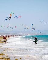 Kiters at the beach in Tarifa, Spain photo