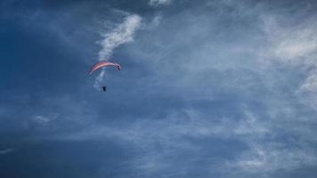 Paraglider soaring in the sky photo