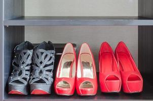 row of red shoes in shelf