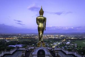 Golden buddha statue in Khao Noi temple, Nan Province, Thailand photo