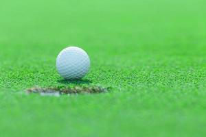 Golf ball on grass in the golf course, Thailand photo
