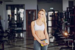 Beautiful blonde doing gym exercises photo