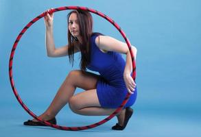 Sport girl fitness woman dancing with hula hoop photo