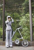 Businesswoman with Folding Bike