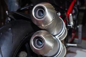 closeup of chromed motorcycle exhaust photo