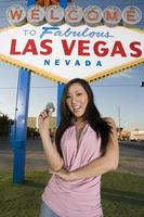 Woman posing in front of Las Vegas sign photo