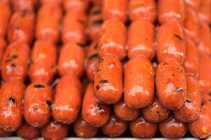 Grilled sausage on street food photo
