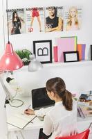 Woman fashion blogger working in a creative office