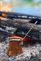 Making coffee in the fireplace  on camping or hiking