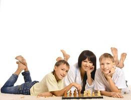 Family playing chess photo