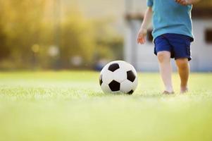 Little boy playing football photo