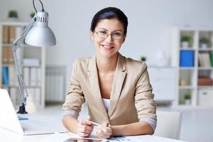 Businesswoman at workplace photo