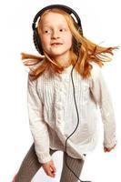 Girl dancing with headphones photo