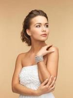 woman with pearl earrings and bracelet photo