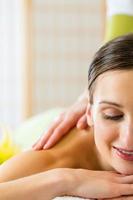 woman having a wellness back massage photo
