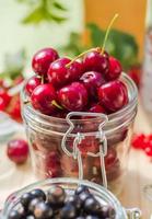 Summer fruits closeup cherries jar processed photo