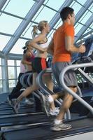 Joggers on Treadmills in Gym photo