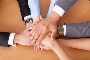 Businesspeople Stacking Hands photo