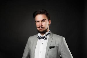 handsome guy with beard and mustache in suit photo