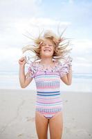 Young girl having fun at beach photo