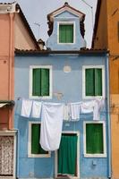 little blue house in Burano near venice photo