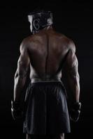 Back of strong young male boxer photo