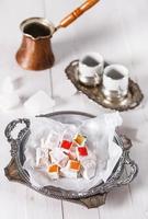 Turkish Delight over white wooden background photo