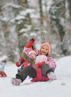 Little girl enjoying a sleigh ride photo