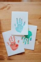 Christmas handprints post cards with tree, deer and snowman photo