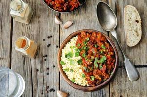 buttered millet with tomato eggplant curry photo