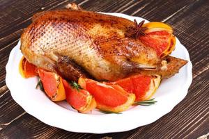 Duck with grapefruits photo