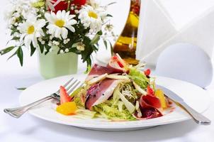 Salad with smoked duck breast photo